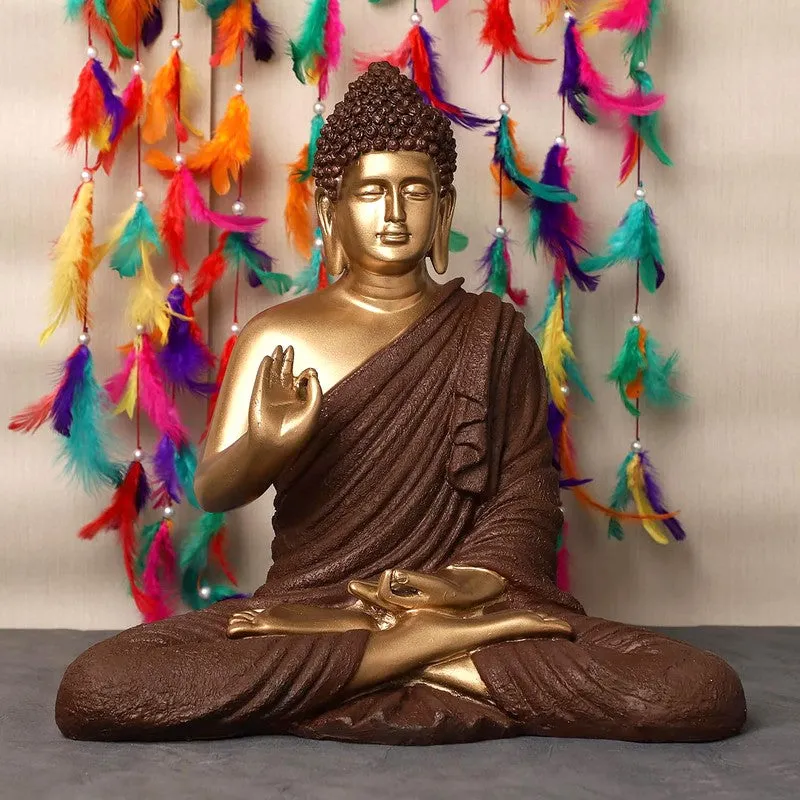 Front view of brown and gold Buddha idol