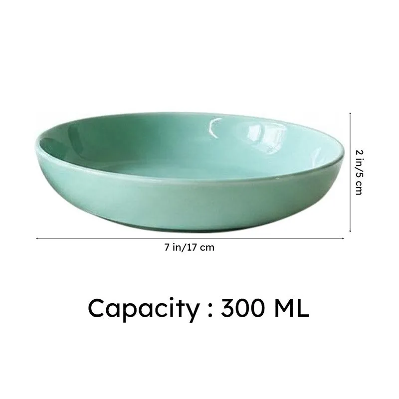 Green ceramic bowl shown against a plain light background