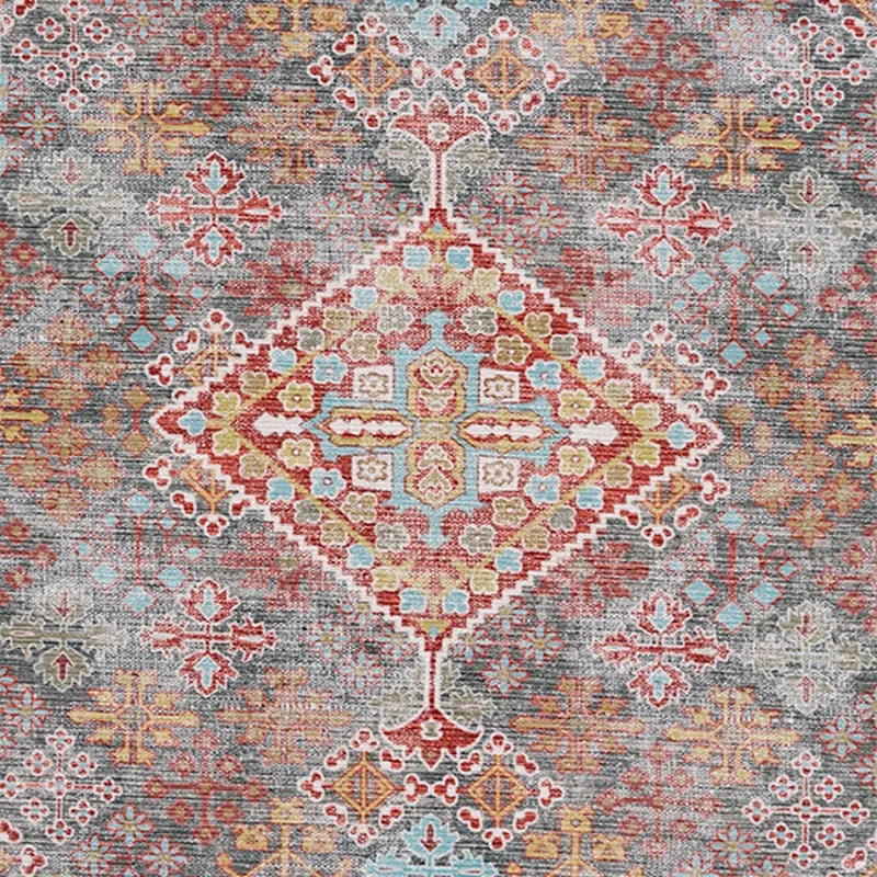 Detailed view of the carpet's central medallion and intricate motifs