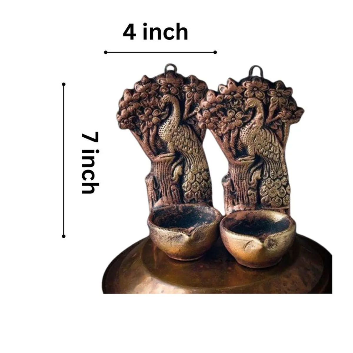 Peacock diyas shown together with a visible 7-inch height and 4-inch width graphic