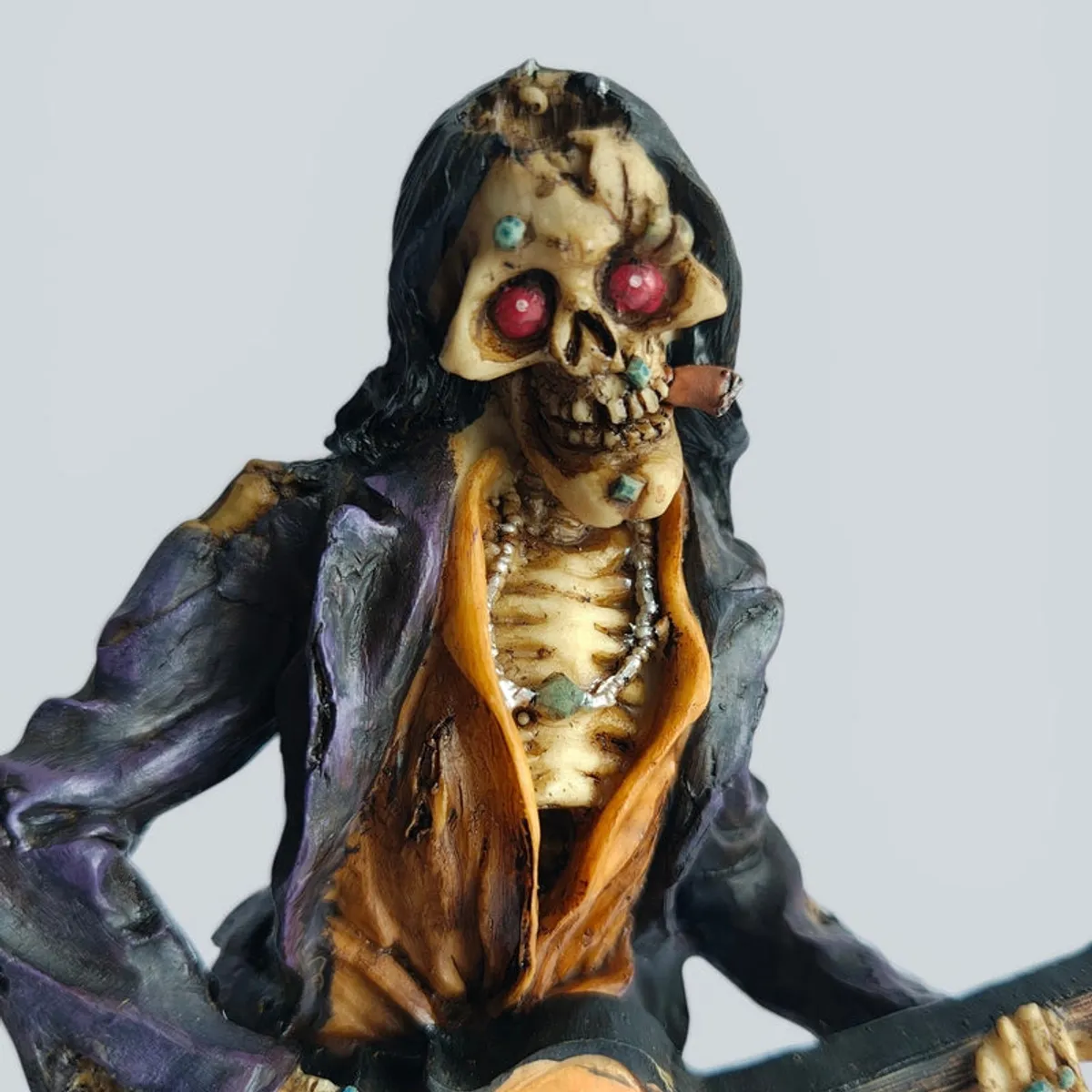 Close-up of the skull face and upper torso of the zombie guitarist showpiece