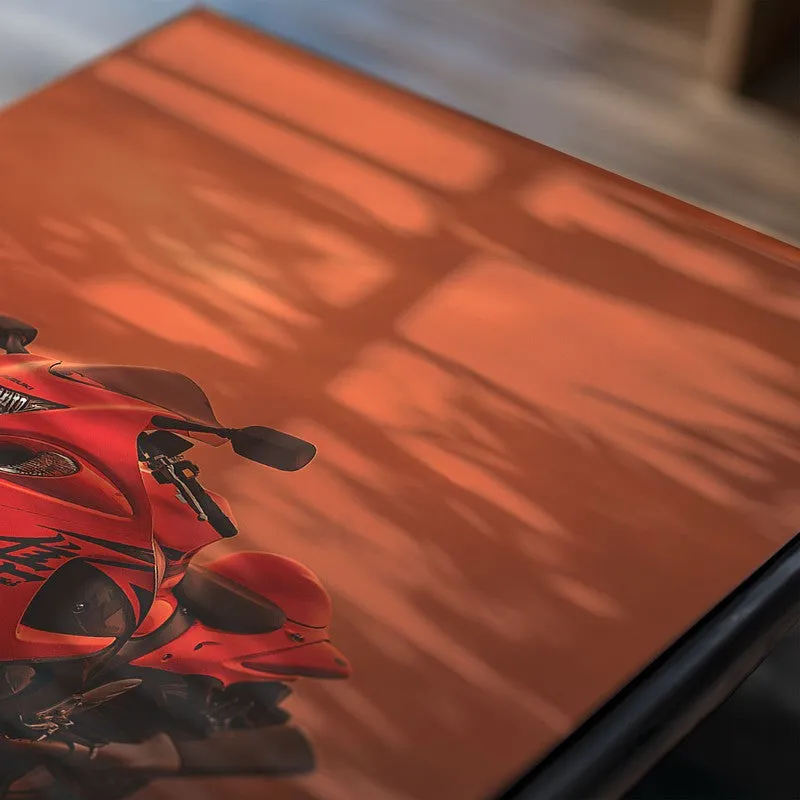 Close-up of a red motorcycle poster with a glossy surface