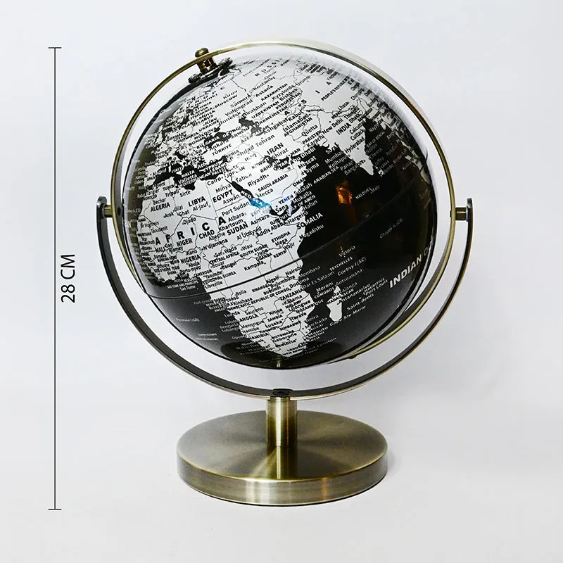 Black globe showpiece with metallic stand photographed against a white background