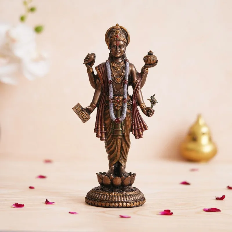 Front view of a bronze-toned Dhanvantari idol standing on a lotus pedestal