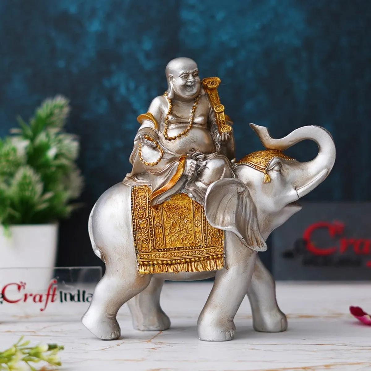 Angled view of ornate silver and gold elephant showpiece
