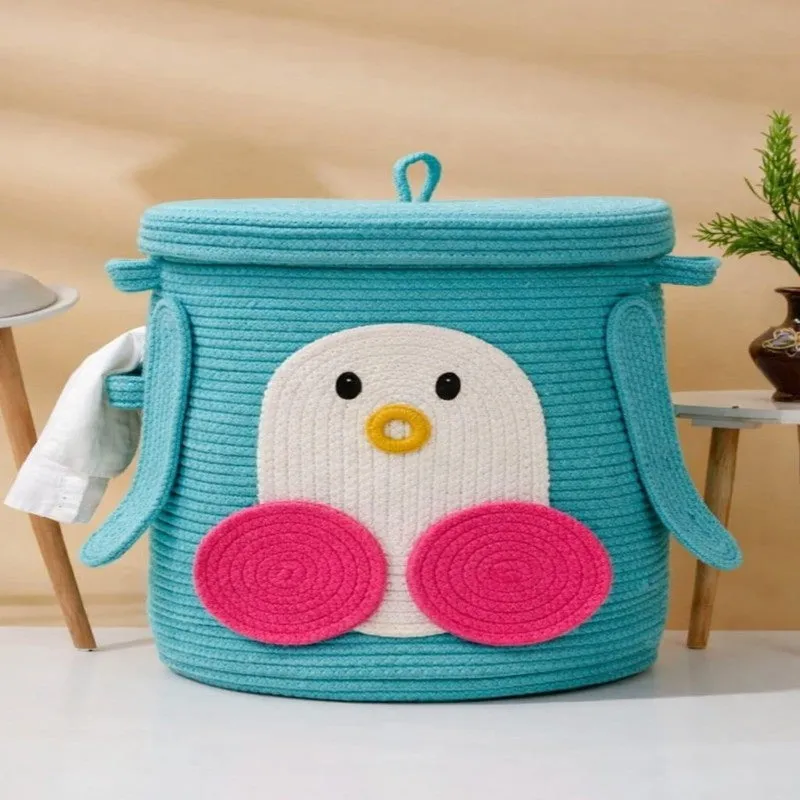 Blue cotton storage basket with penguin design, lid and side handles