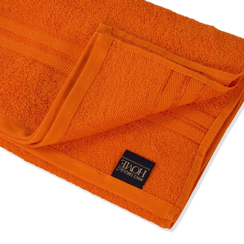 Close-up of the orange towel’s soft textured fabric and bordered edge