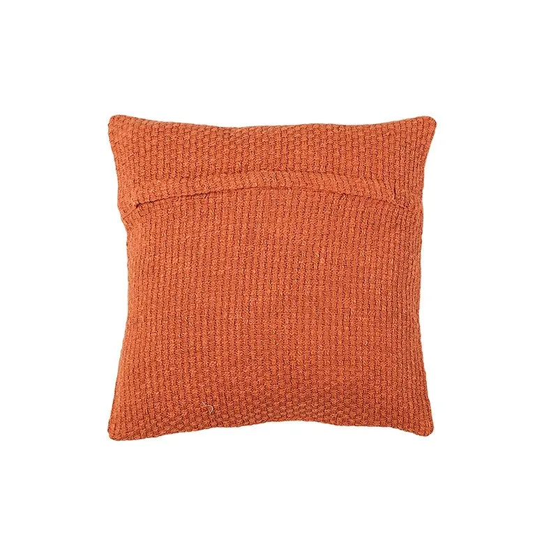 Back view of an orange square textured cushion cover