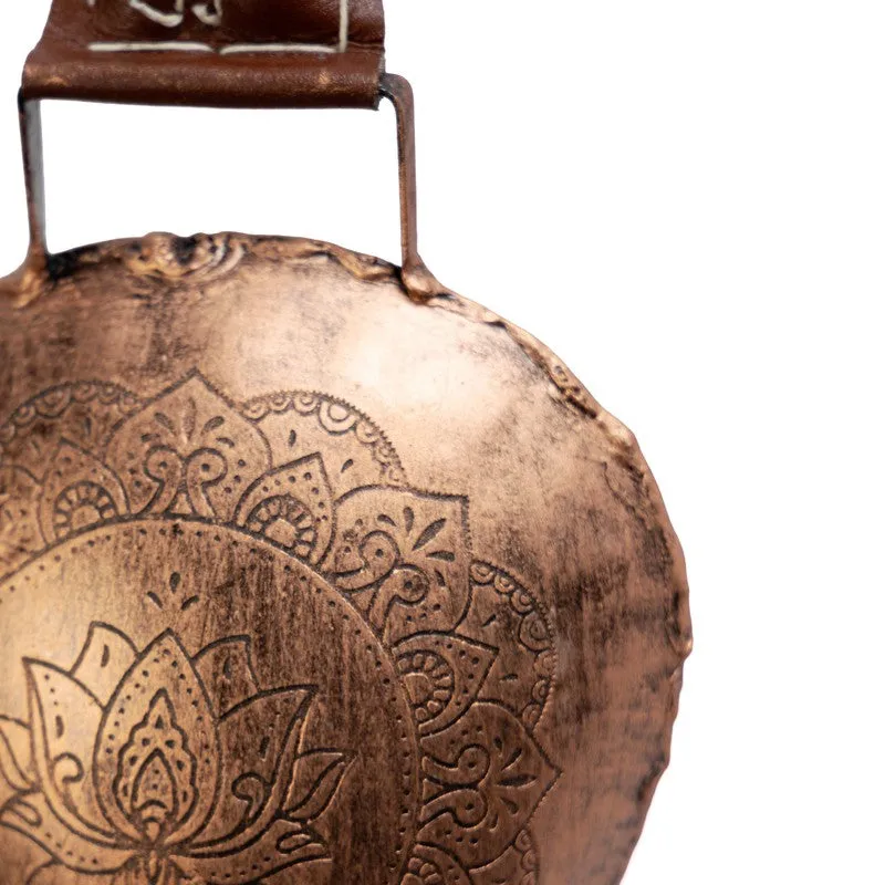 Close-up view showing the textured copper surface and floral motif on the bell.