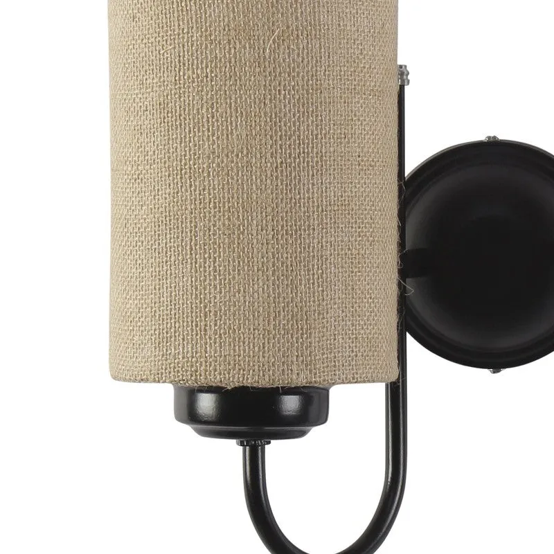 Close-up of jute shade and black iron arm on the wall lamp