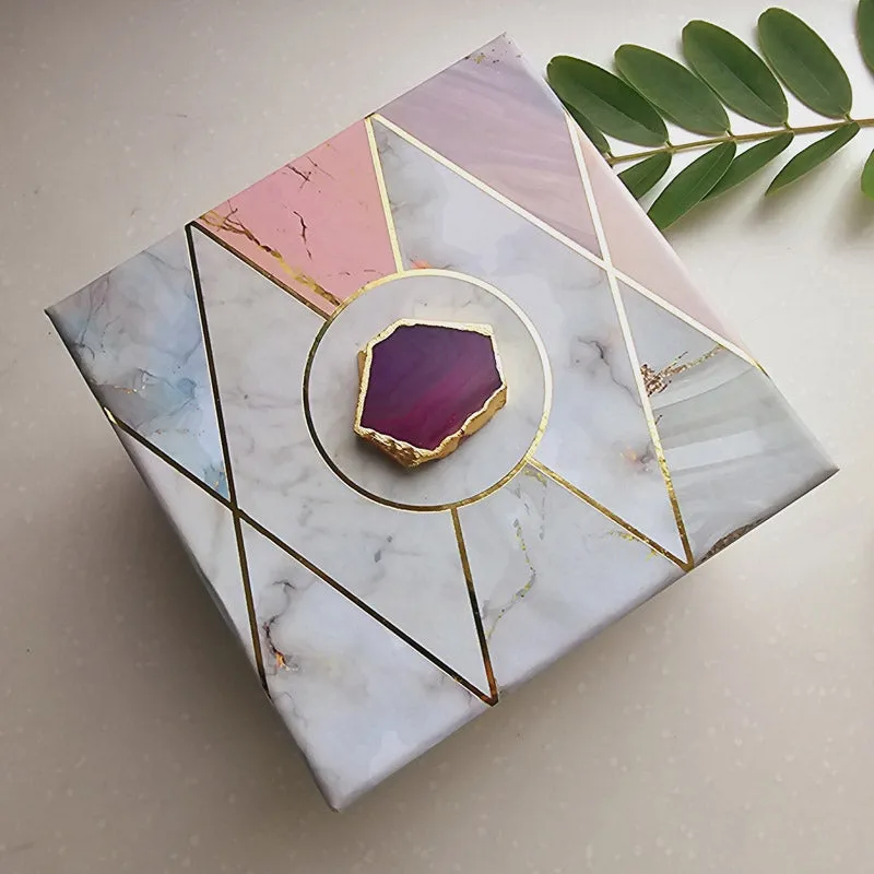 Decorative gift box with pastel marble effect and geometric gold lines