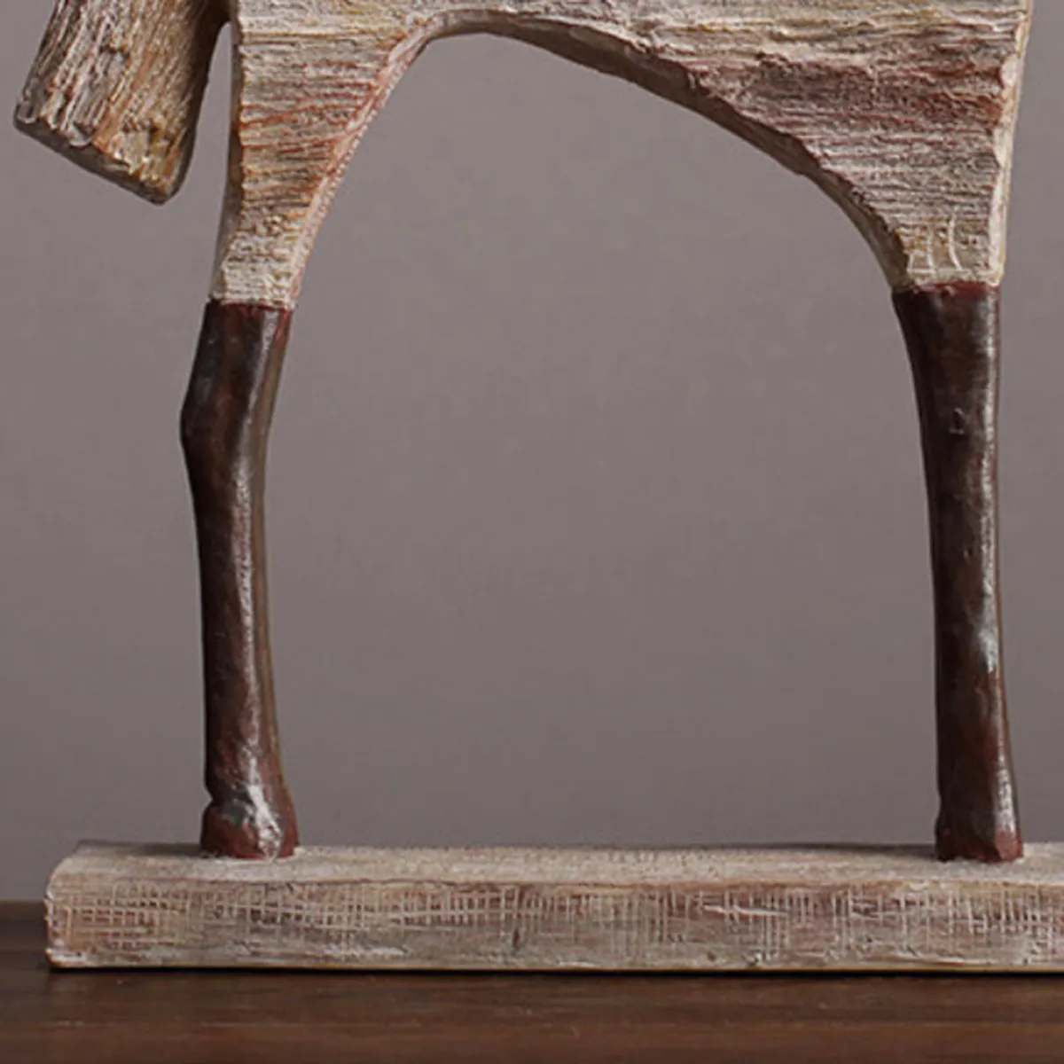 Close-up of the lower body and legs of the horse showpiece on its base