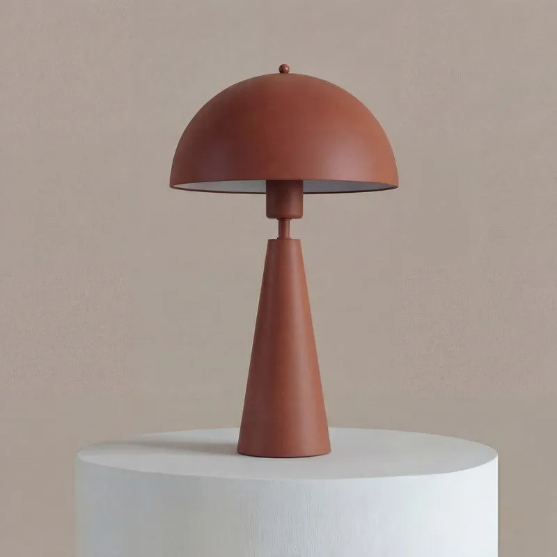 Front view of a brown metal table lamp with a rounded shade
