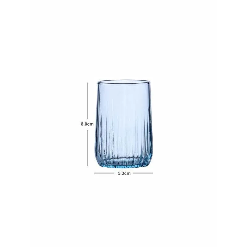Single blue tinted glass tumbler on a white background