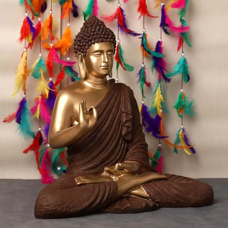 Angled view of brown and gold Buddha idol