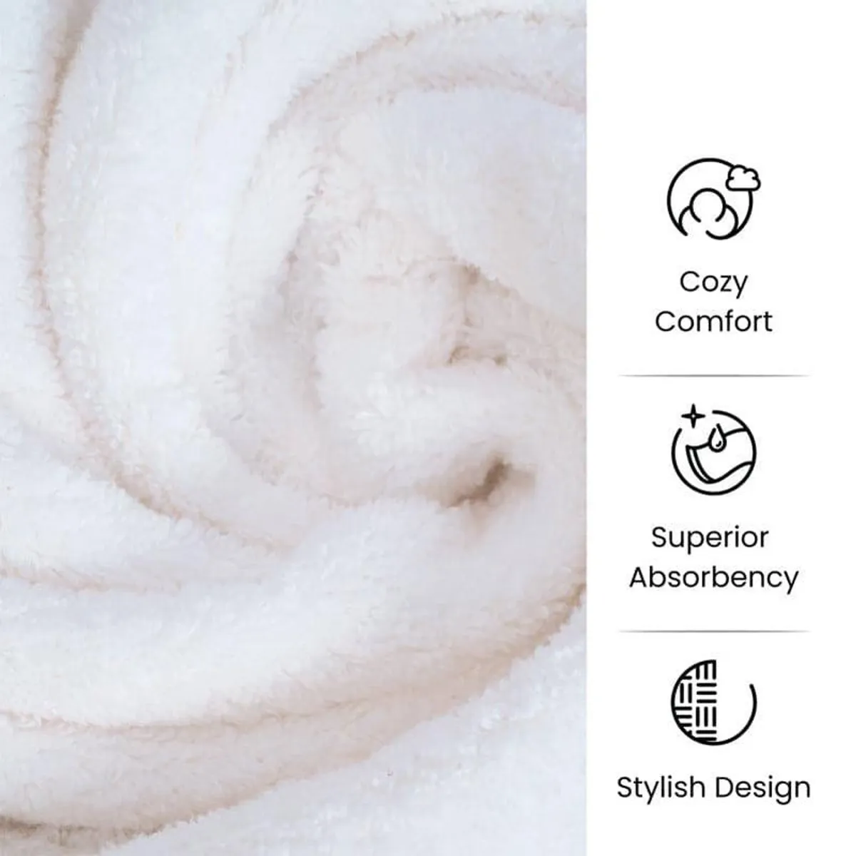 Close-up view of the towel's soft white plush surface and rolled folds