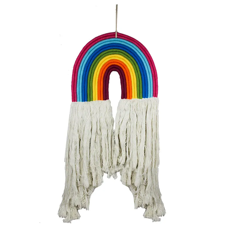 Front view of a multicolour rainbow wall hanging with cream tassels