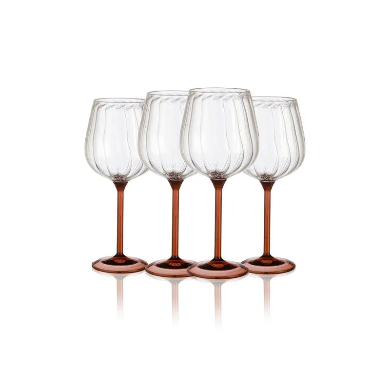 Four clear ribbed wine glasses with tawny stems arranged in a row