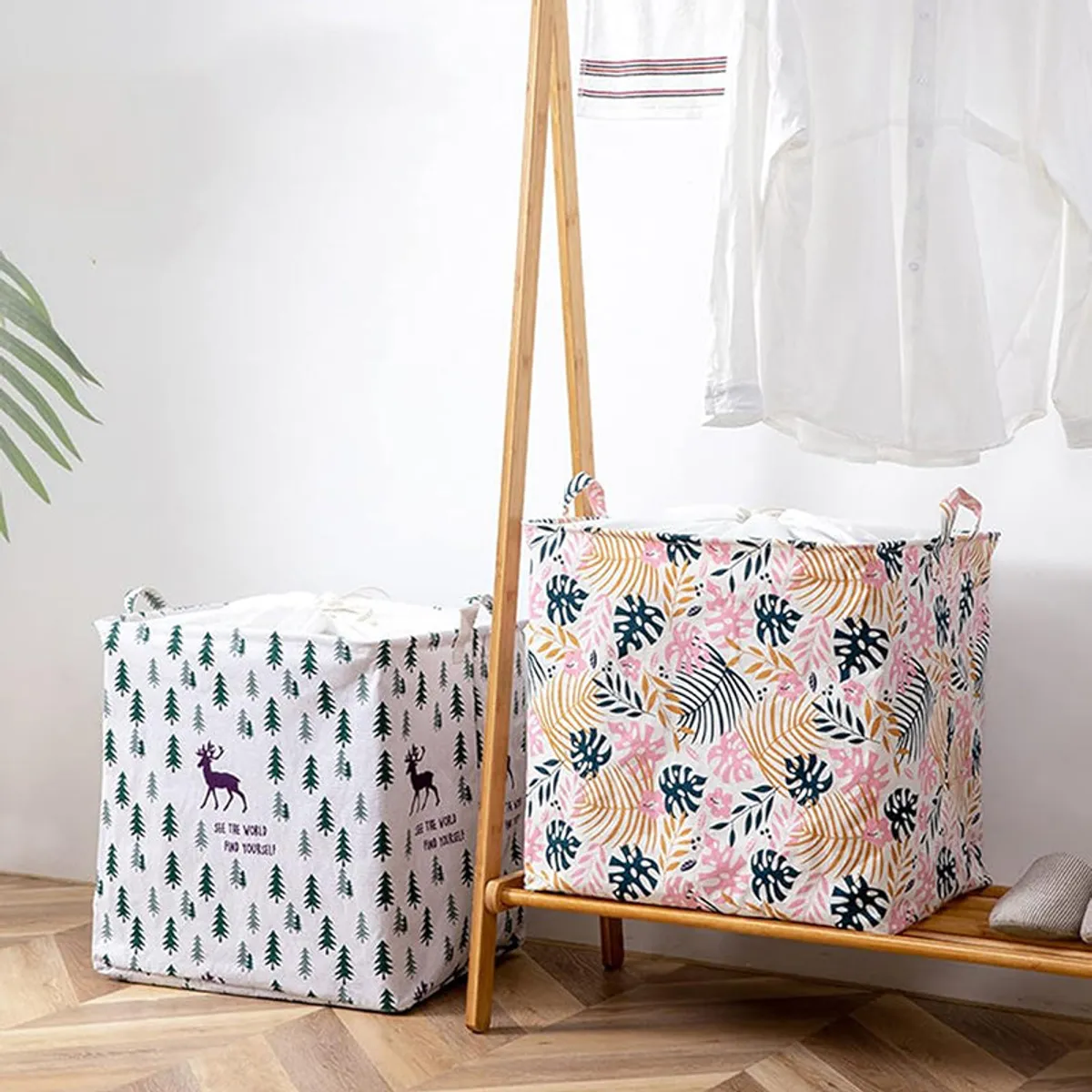 Pink leafy laundry basket displayed beside another patterned basket