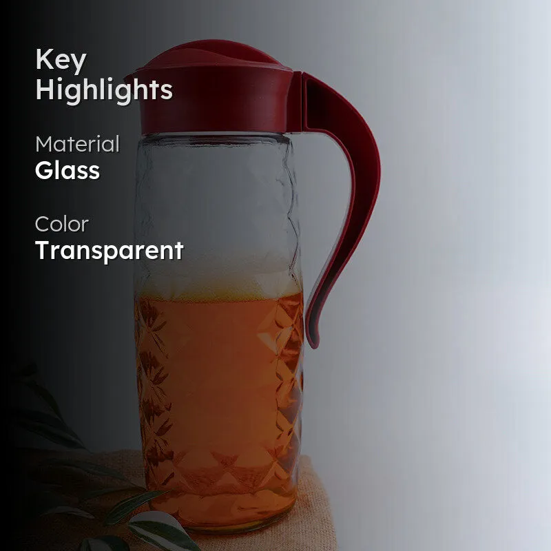 Transparent textured glass jug with red lid and handle