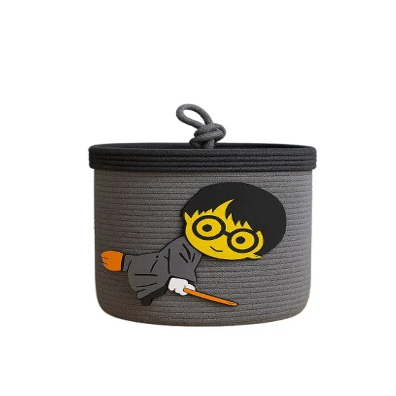 Grey cotton storage basket with lid and playful wizard motif on a plain background