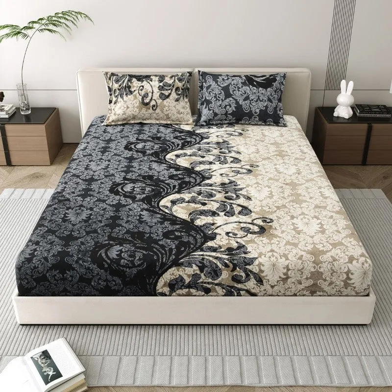 Front view of a bed with a black, white and beige floral bedsheet