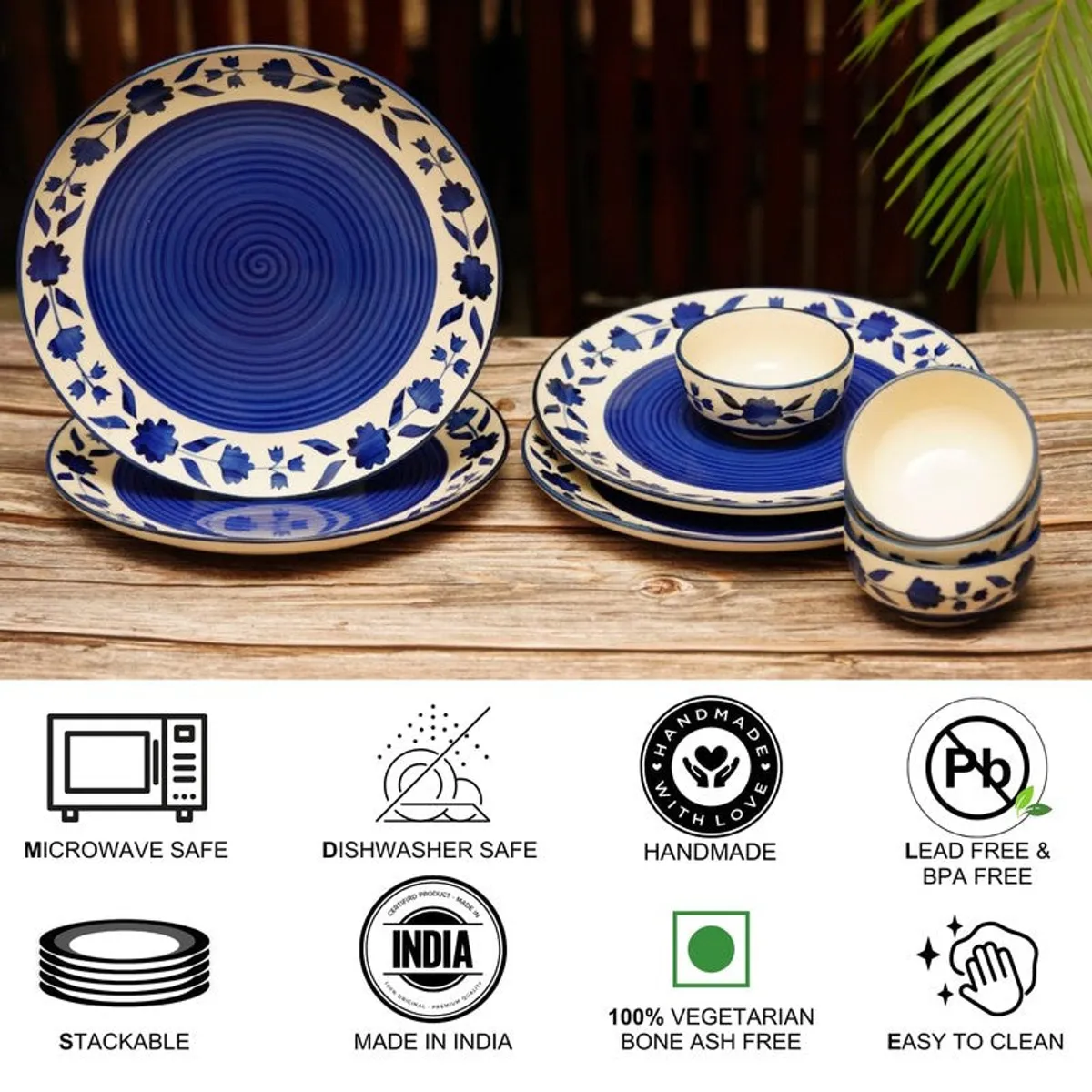Blue floral ceramic plates and bowls arranged on a wooden table