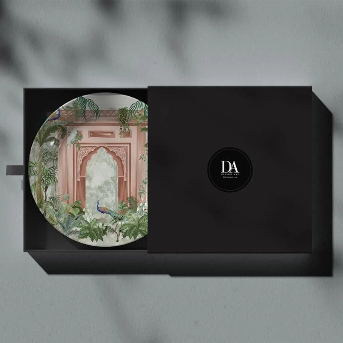 Decorative wall plate presented inside a black gift box