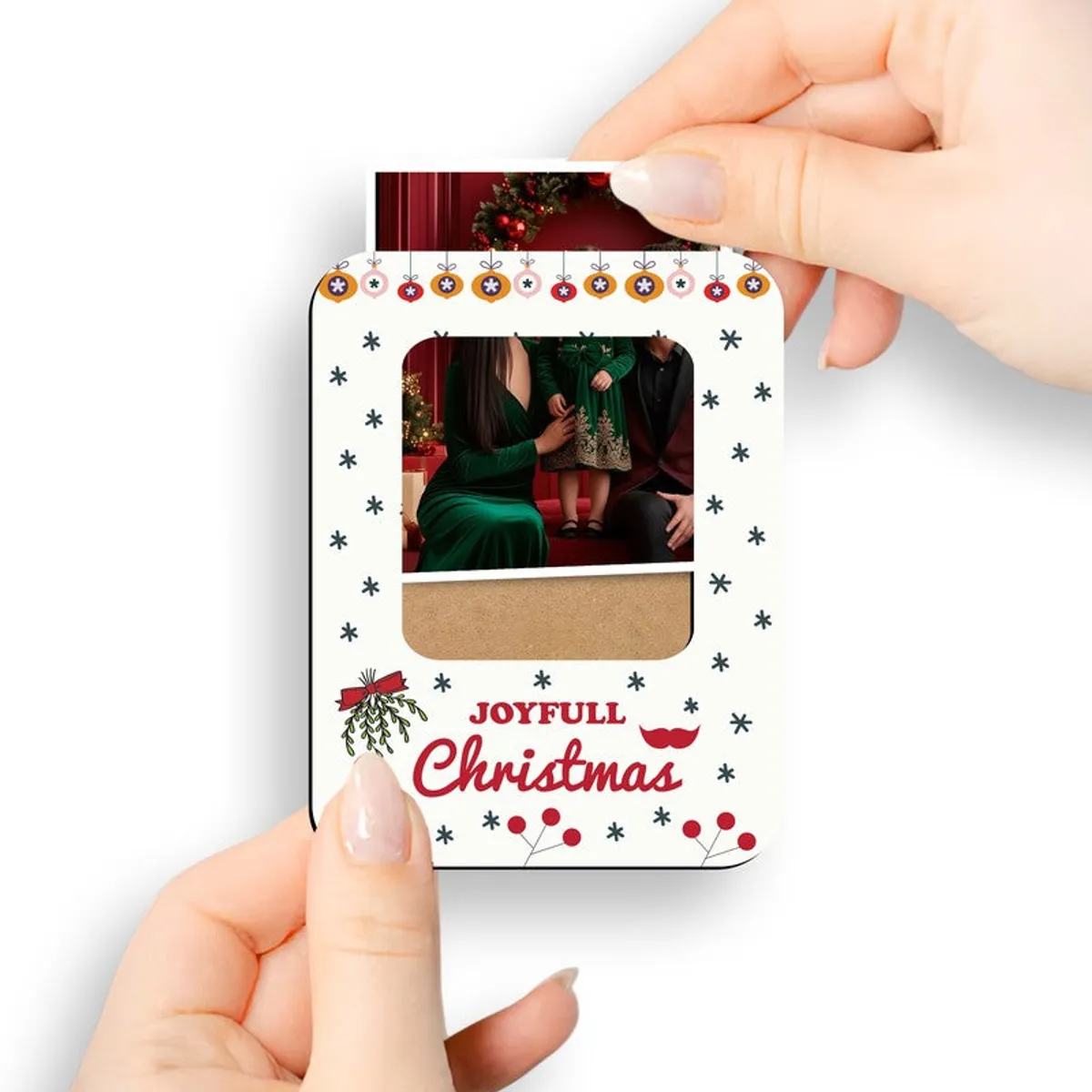Close-up of a white Joyful Christmas magnetic photo frame with festive border