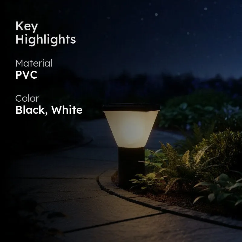 Outdoor lamp glowing on a garden path with black and white highlight text