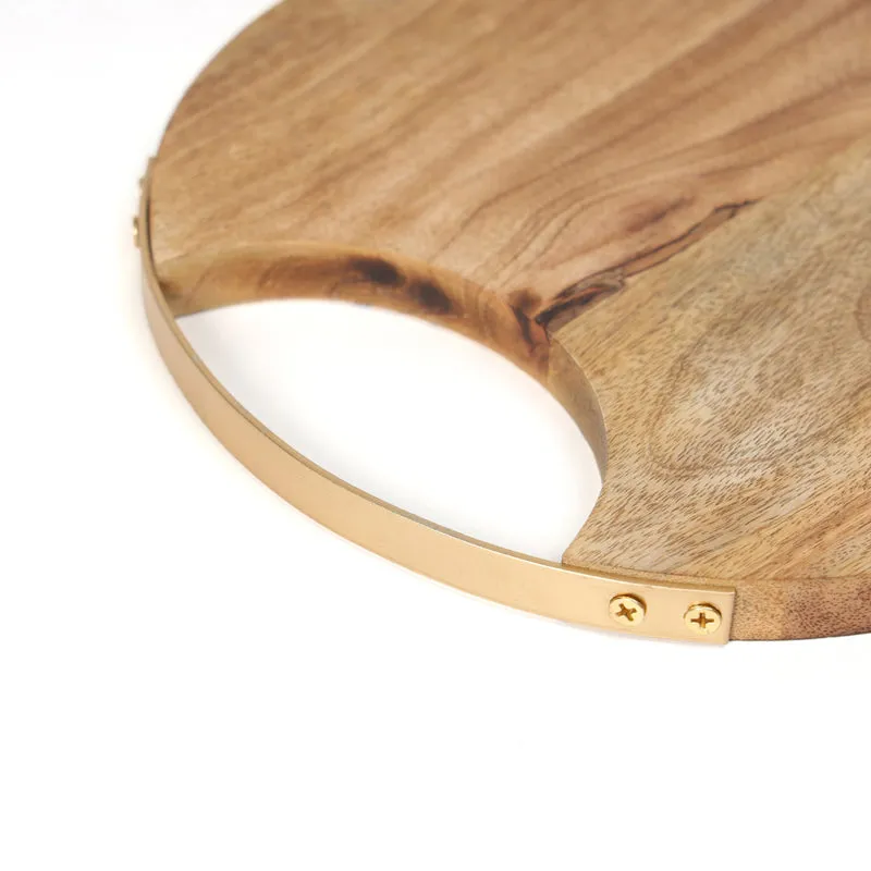 Close-up of the mango wood board showing its brass edge and handle opening
