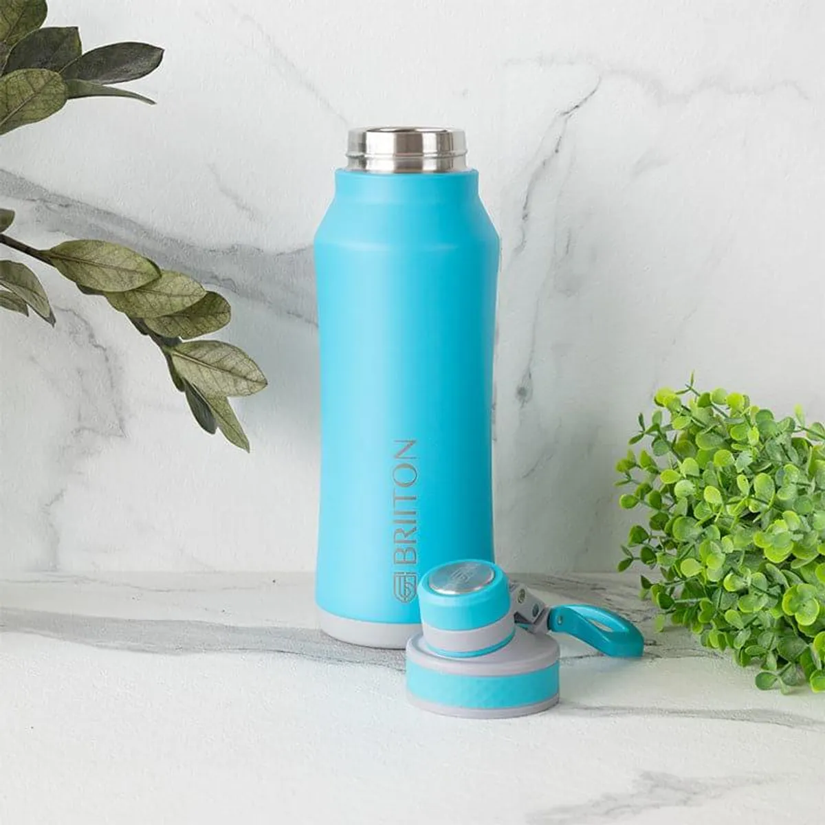Blue insulated bottle displayed with its detached lid beside it