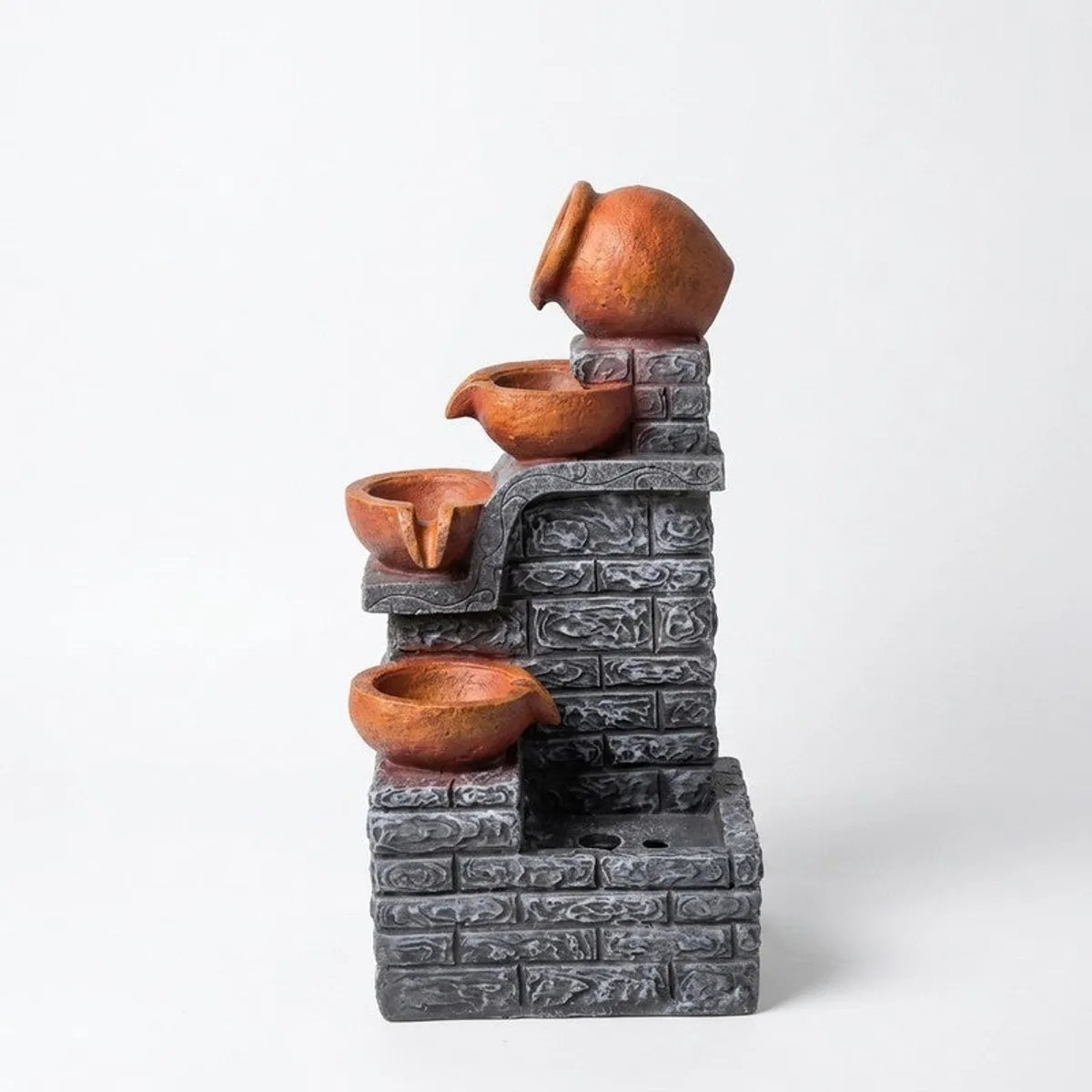 Freestanding brown and grey cascade fountain shown against a white background