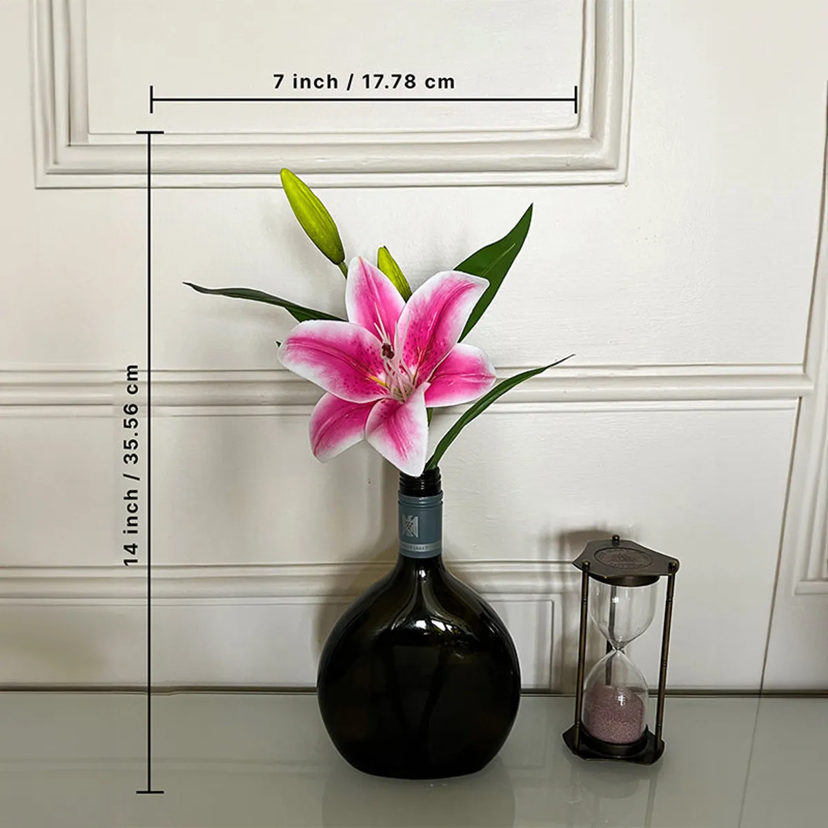 Artificial pink lily flower shown with its 14-inch height and 7-inch width.