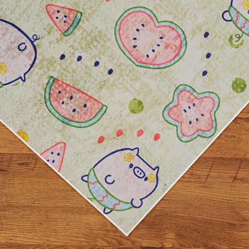 Corner view of the rectangular carpet with playful fruit and pig pattern