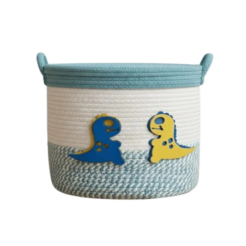 Cylindrical blue and white storage basket with yellow and blue dinosaur appliques