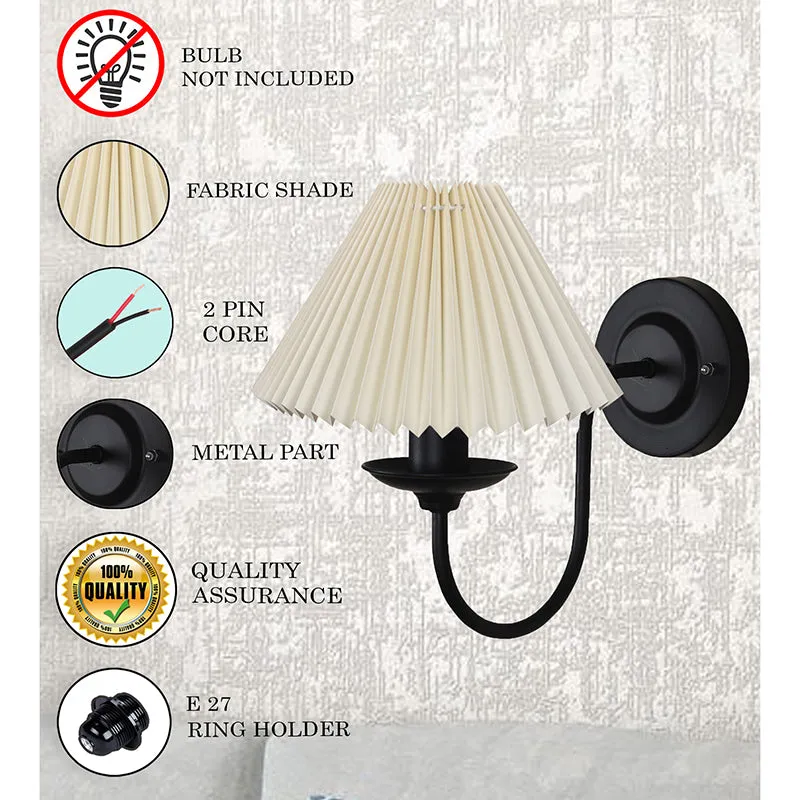 Wall lamp with ivory pleated shade and black metal arm shown with feature callout graphics