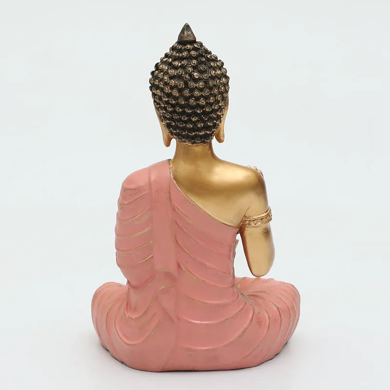 Back view of pink and gold Buddha idol