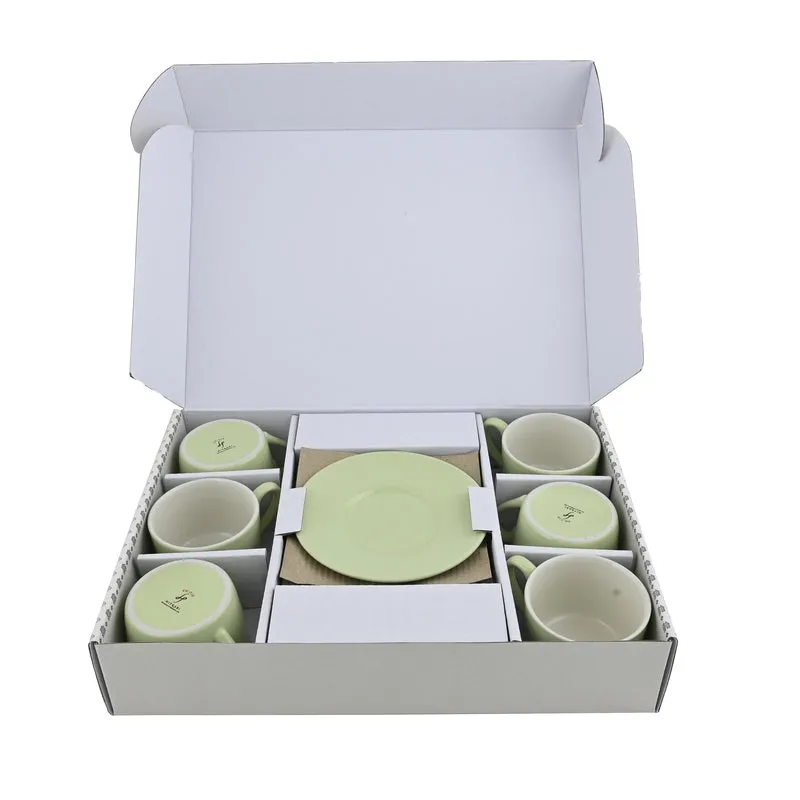 Open box showing six green cups and six saucers in protective compartments