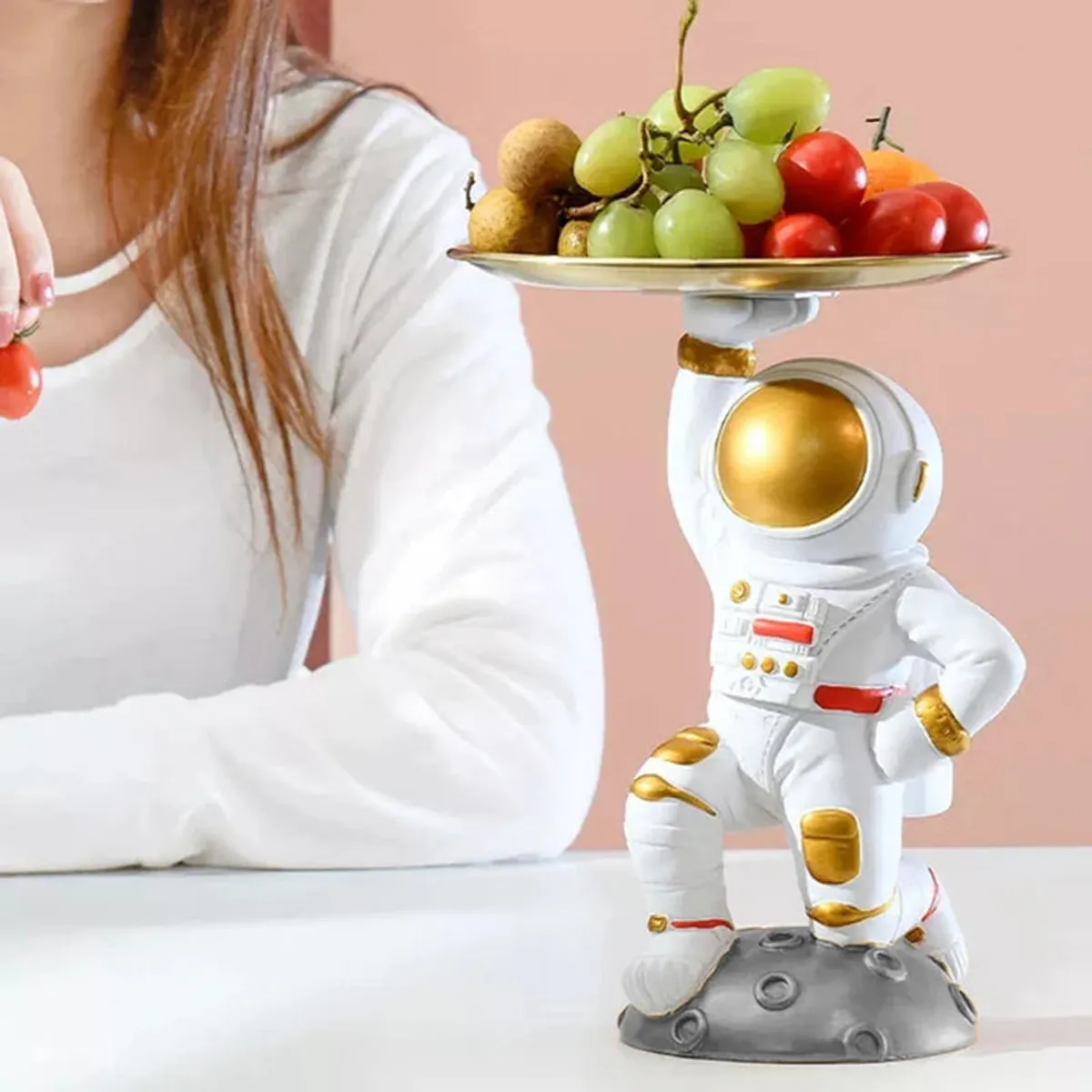 Astronaut tray showpiece styled with grapes and cherry tomatoes on a tabletop