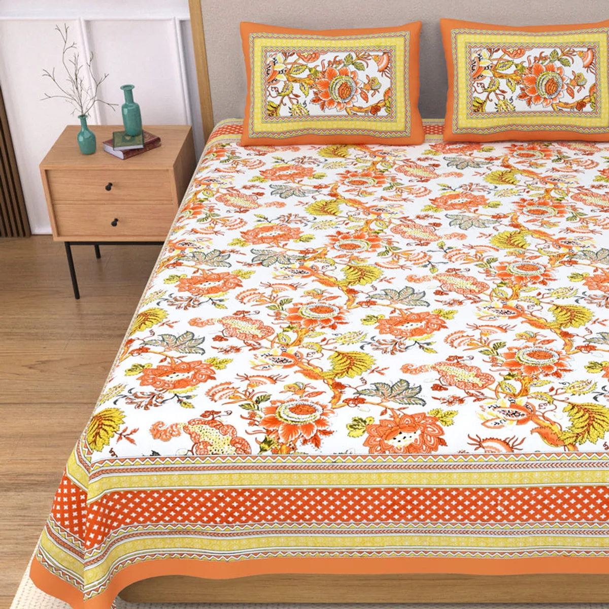 Close view of the floral bedsheet with orange geometric border detailing