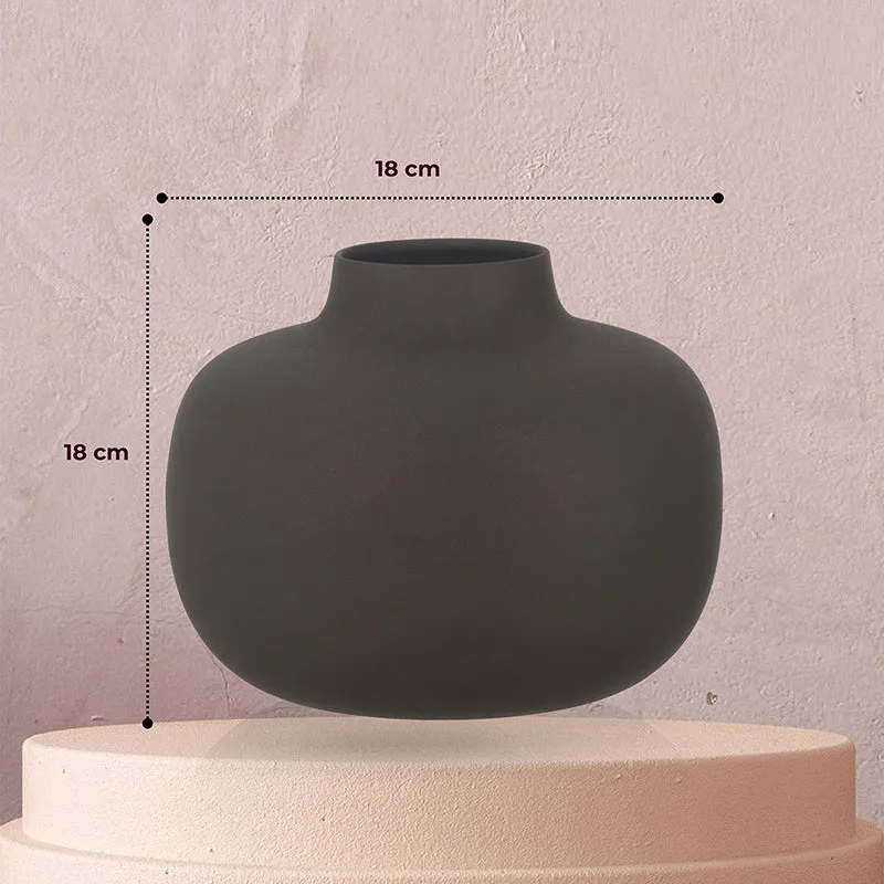 Black globe vase shown from the front on a pedestal