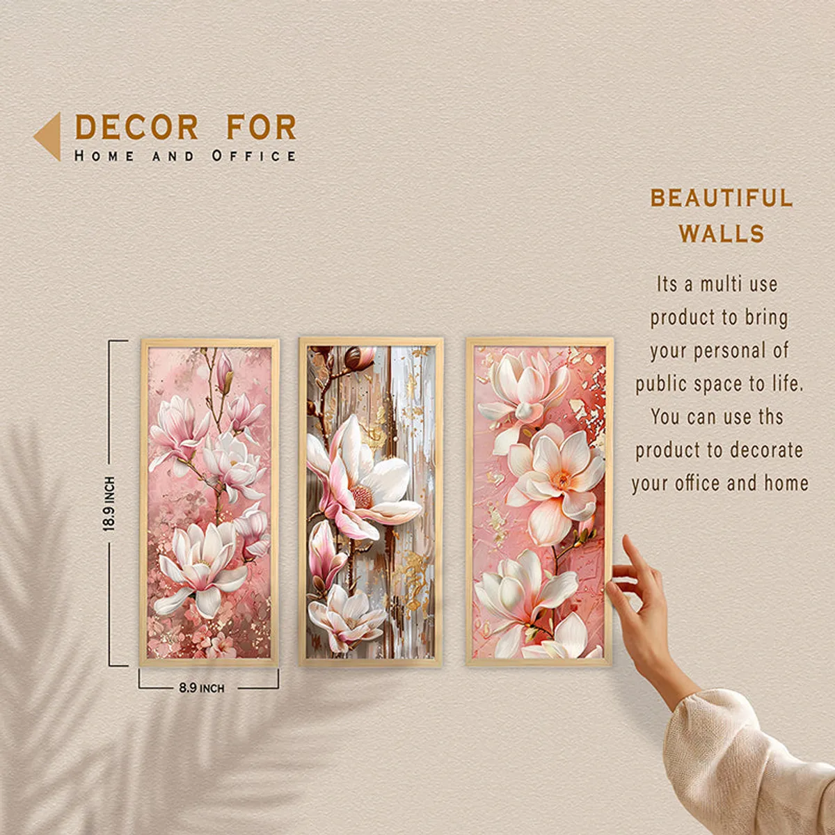 Three framed floral wall art panels displayed with a hand nearby