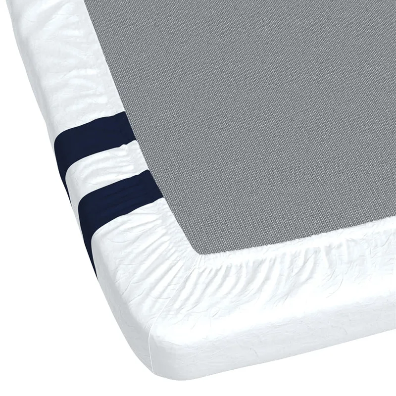 Corner view of the white fitted bedsheet showing elastic edging and navy stripes.