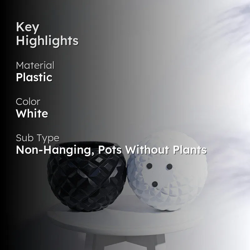White and black round planters with faceted geometric surfaces displayed together.