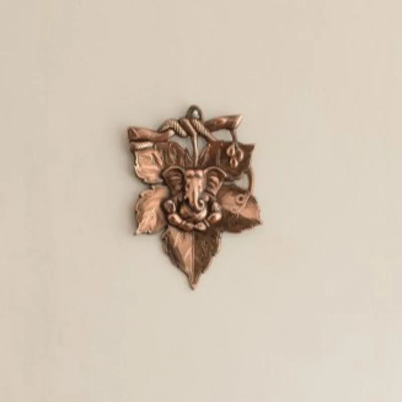 Vigneshwara Resting On Leaf Religious Metal Wall Accent media 1