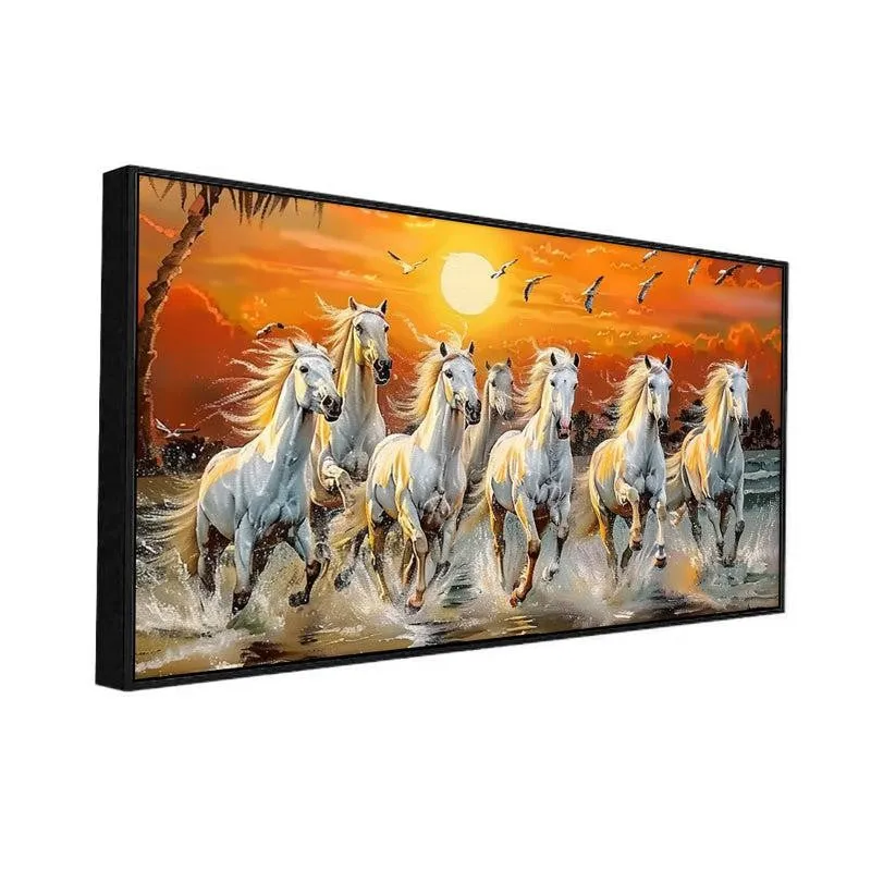Angled view of black-framed canvas painting with white horses and sunset scene