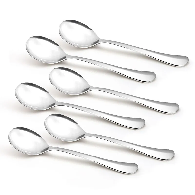 Six silver soup spoons arranged diagonally on a white background
