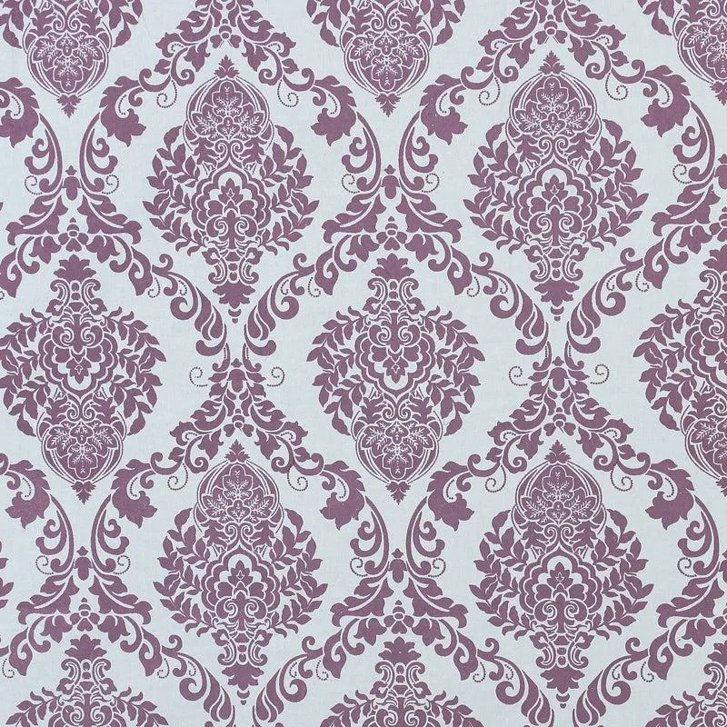 Detailed view of repeating purple damask motifs on a white background