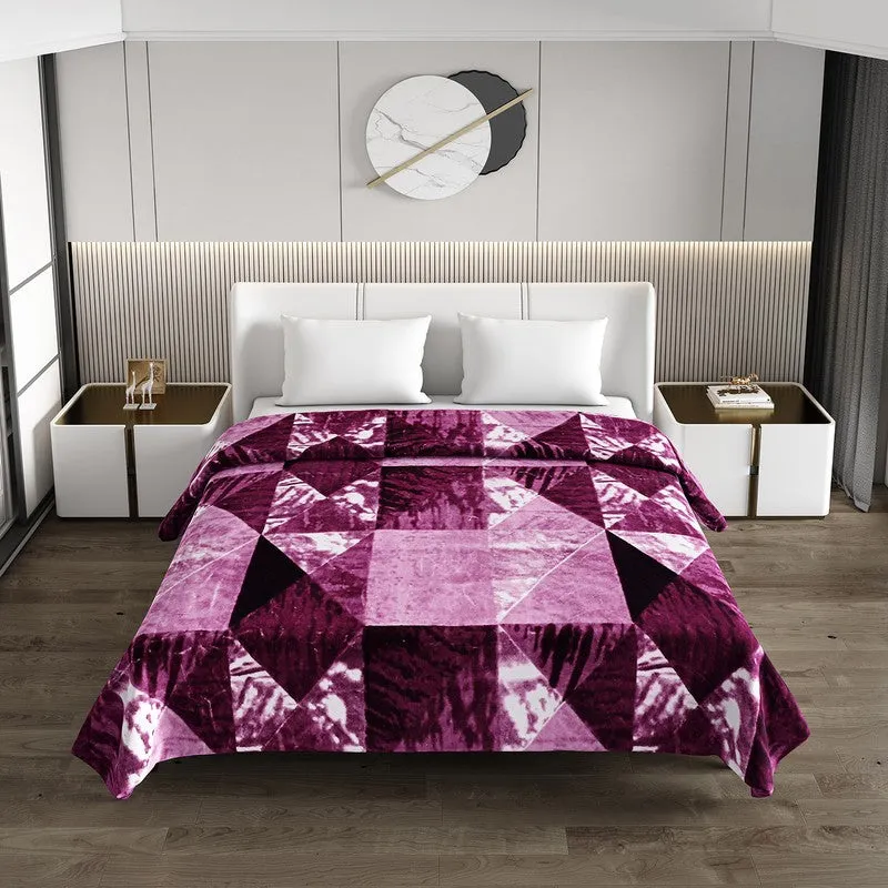 Violet geometric blanket styled on a double bed in a modern bedroom